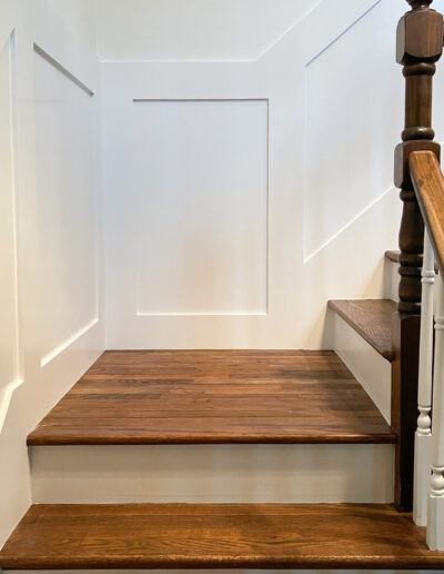 Upgrade of an old stairway with wall panels by MM Home Improvements in Devon